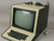 A small TTY that looks like a computer monitor with a built-in keyboard.