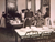 Women wash dishes in the dining room